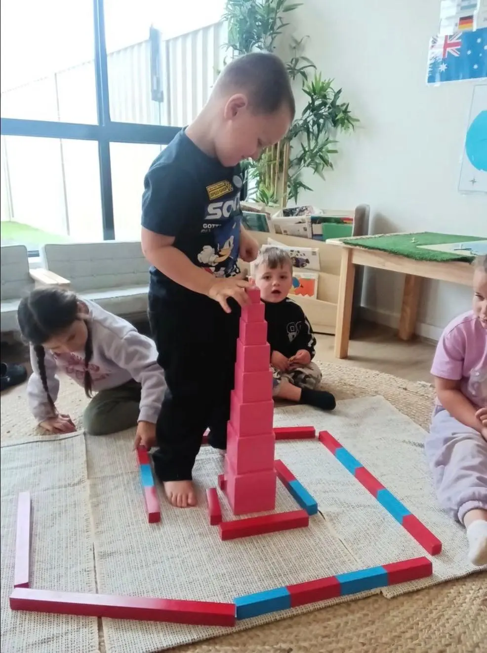 A young child concentrating on wooden Montessori materials in the Shepparton centre's classroom